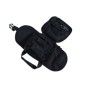 The black pouch fully opened flat, displaying the internal organization compartments and elastic loops.