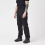 Black Helikon-Tex Urban Tactical Flex pants shown on a model to display the low-profile tactical fit.