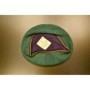 Used German Army Green Beret flipped upside down on a table showing the interior